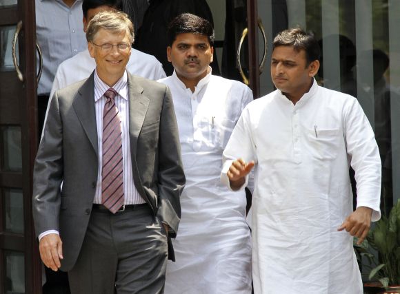 Akhilesh Yadav talks with Microsoft co-founder Bill Gates after their meeting in Lucknow