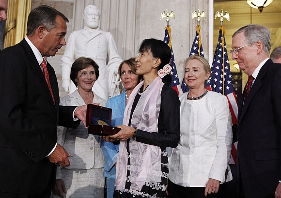 Suu Kyi is presented with the Congressional Gold Medal by House Speaker John Boehner at the U S Capitol in Washington. Also present at the ceremony are: (left to right) former first lady Laura Bush, House Minority Leader Nancy Pelosi, Secretary of State Hillary Clinton and Senate Minority leader Mitch McConnell
