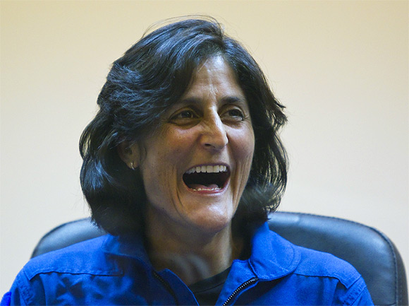 Sunita Williams reacts during a news conference at the Baikonur Cosmodrome
