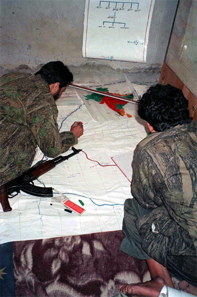 Militants of the LeT study a map of a target inside Jammu and Kashmir