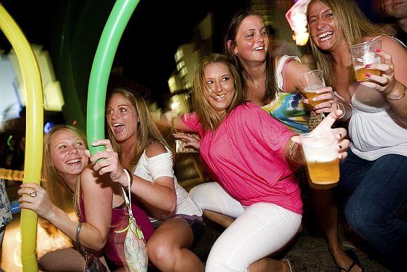 Tourists dance in a discotheque in Cancun in the Mexican state of Quintana Roo