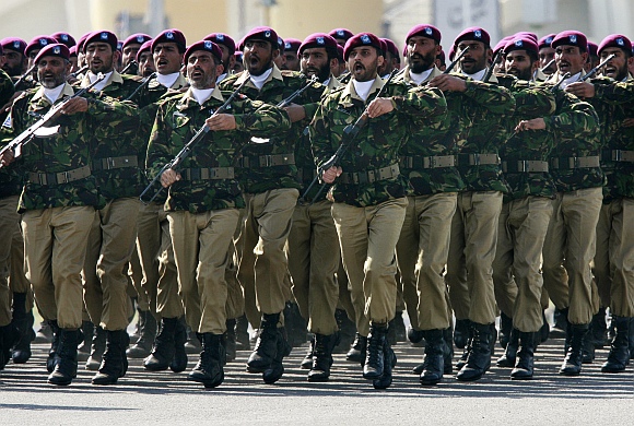 Commandos from the Special Service Group march during Pakistan's National Day military parade in Islamabad