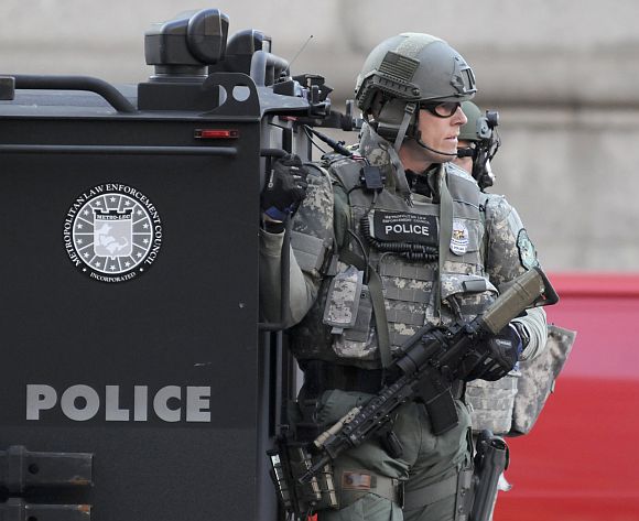 SWAT officers patrol the Copley Square area after explosions near the finish line of the Boston Marathon in Boston