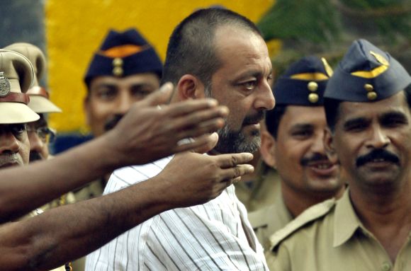 Sanjay Dutt is surrounded by police personnel as he leaves Yerwada jail after his release in Pune on August 23, 2007.