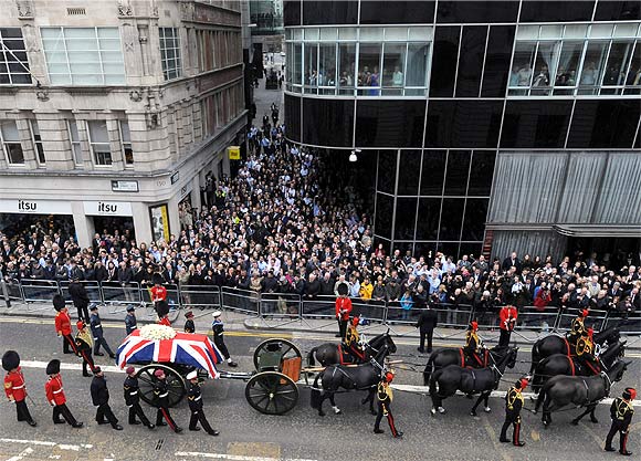 The funeral procession travels along Fleet Street to her funeral service at St Paul's Cathedral