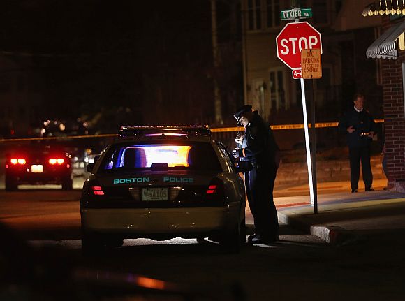 Police investigate along Dexter Avenue in the early morning hours on April 19