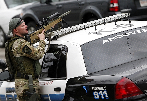 SWAT teams conduct a house to house search as they look for Dzhokar Tsarnaev