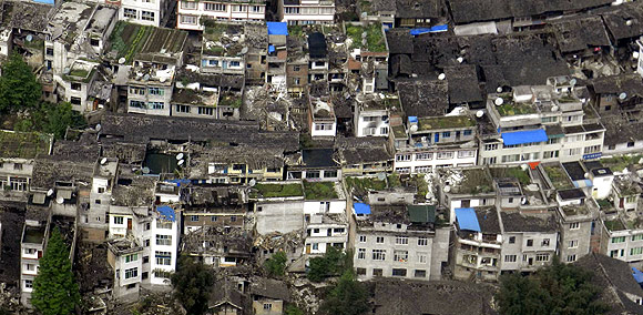 An aerial view shows houses damaged after a strong earthquake in Lushan county, Ya'an, Sichuan province