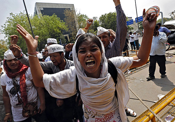 Demonstrators shout slogans during a protest outside police headquarters in New Delhi