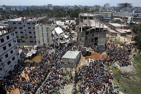 Crowds gather at the collapsed Rana Plaza building