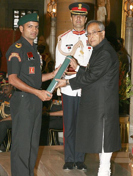 President Pranab Mukherjee presenting the Ati Vishisht Seva Medal to Subedar Major Vijay Kumar