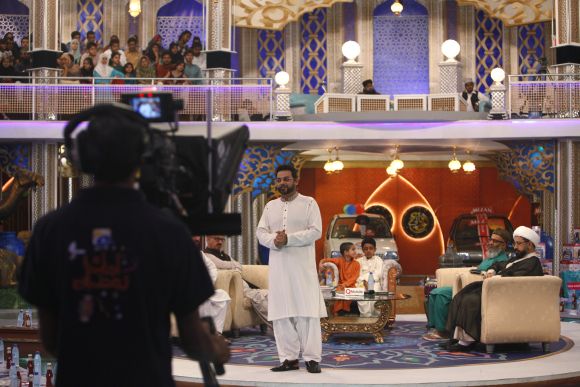 Aamir Liaquat Hussain, host of the Geo TV channel programme Amaan Ramazan, hosts a live show in Karachi