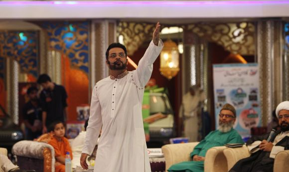 Aamir Liaquat Hussain, host of the Geo TV channel programme Amaan Ramazan, gestures during a live show in Karachi 