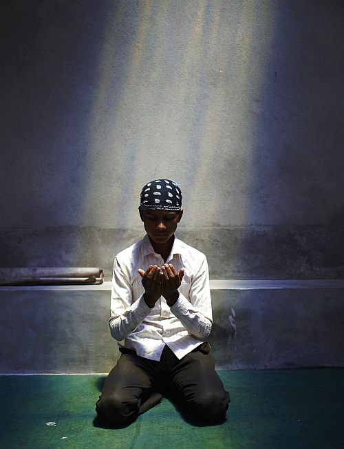 A Nepalese Muslim boy offers Friday prayers in Kathmandu
