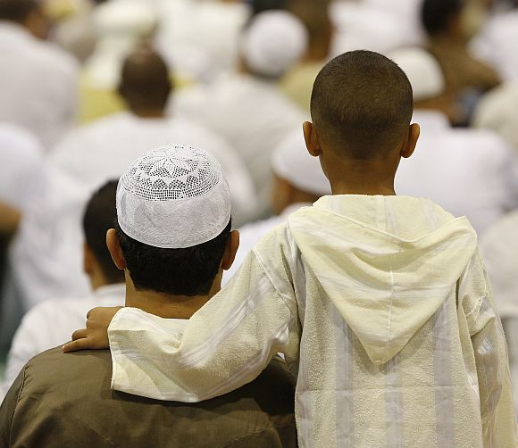 Hugs and prayers mark Eid around the world