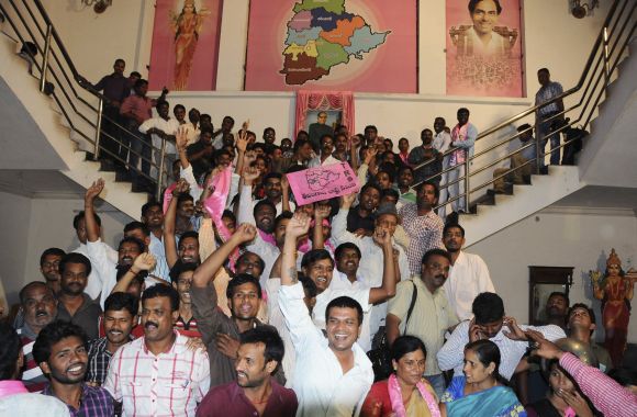 TRS supporters cheer as they celebrate after the announcement of separate Telangana at their headquarters in Hyderabad 