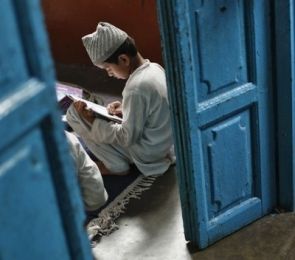 A student studying in a madrassa