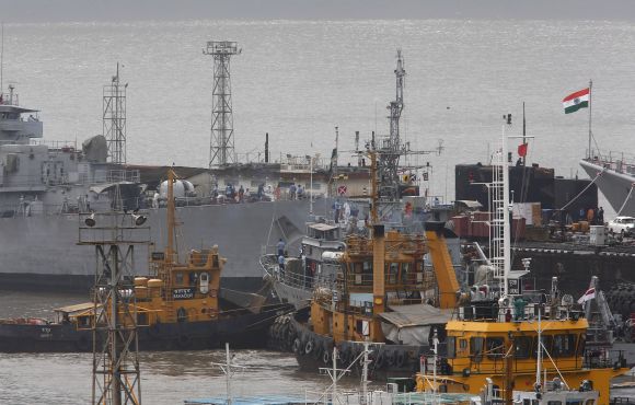 Ships and a submarine belonging to the Indian Navy are seen docked at the naval dockyard in Mumbai on Wednesday.