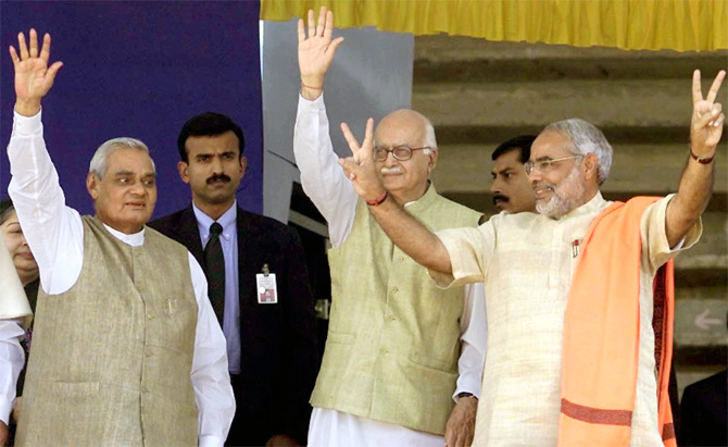 BJP leaders Atal Bihari Vajpayee and L K Advani with Gujarat Chief Minister Narendra Modi at a political rally