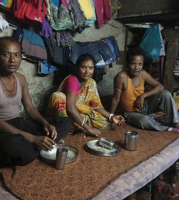 Deepali sits down for a meal with her husband (right)