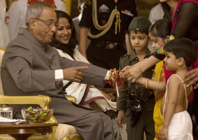 School children tie 'rakhi' to Pranad Mukherjee at Rashtrapati Bhavan