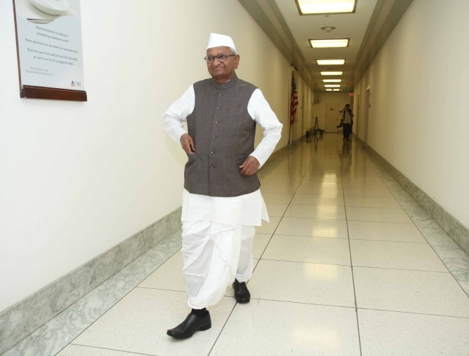 Hazare walks in the empty corridors of Capitol Hill