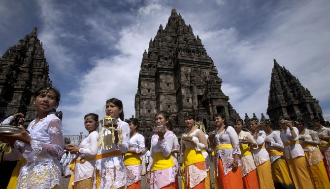 Balinese Hindu worshipers walk during the Tawur Agung ritual ahead of 'Nyepi', Bali's Day of Silence and the Hindu New Year, at Prambanan temple in Yogyakarta