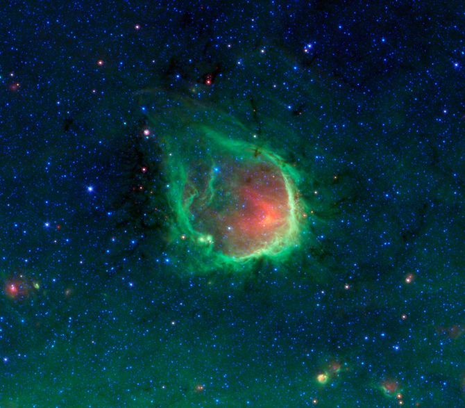 This glowing emerald nebula seen by NASA's Spitzer Space Telescope
