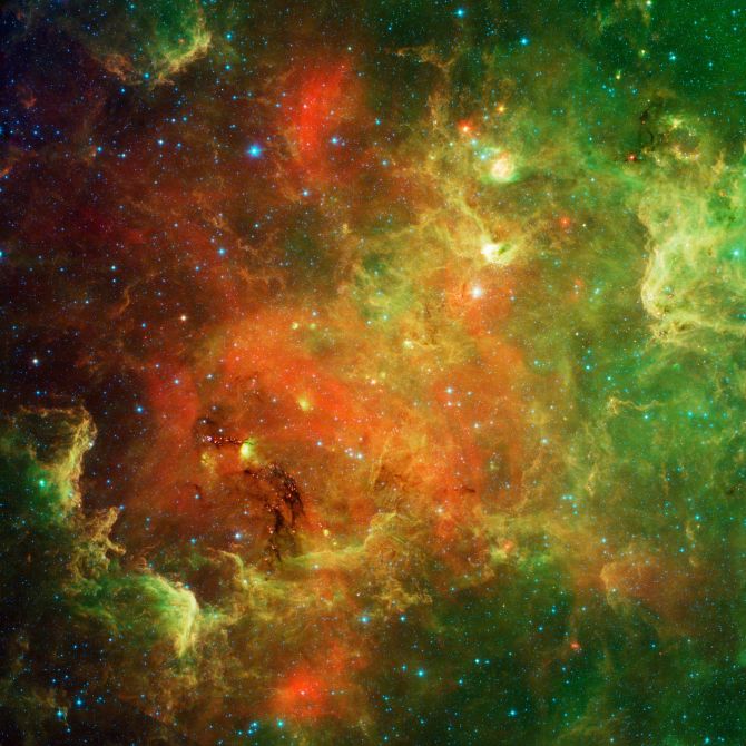 The swirling landscape of stars known as the North American nebula is shown in this image observed by Spitzer telescope