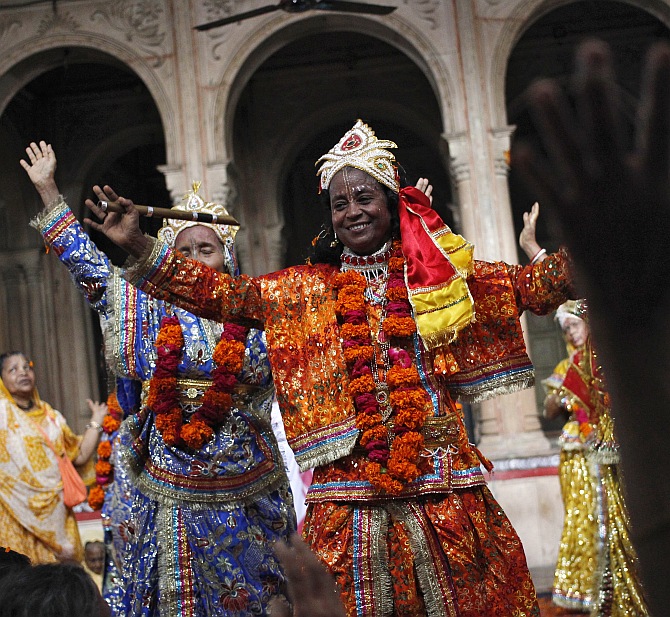 A widow dressed as Krishna's consort, Radha, dances during celebrations to mark Janmashtami at the Meera Sahavagini ashram in Vrindavan in Uttar Pradesh