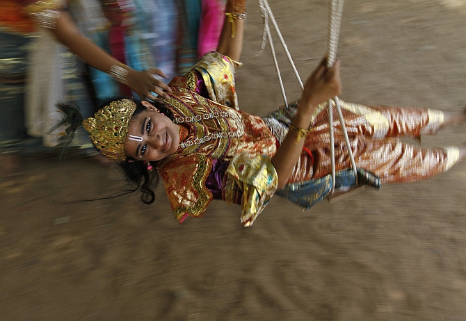 A student dressed as Krishna takes part in the celebrations to mark Janmashtami at a college in Chennai.