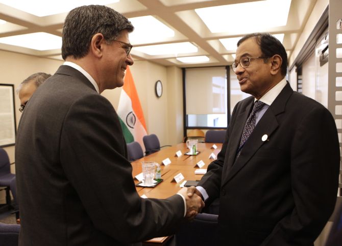 Finance Minister P Chidambaram, right, greets US Treasury Secretary Jack Lew..