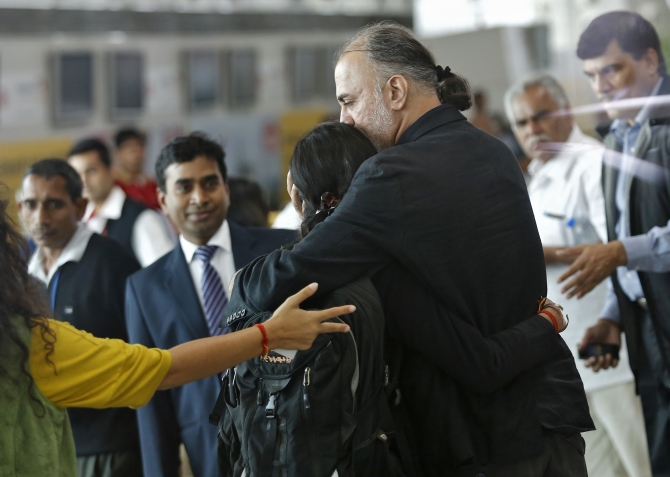 Tarun Tejpal, the 50-year-old founder and editor-in-chief of investigative magazine Tehelka, hugs an unidentified relative at the airport on his way to Goa, in New Delhi 
