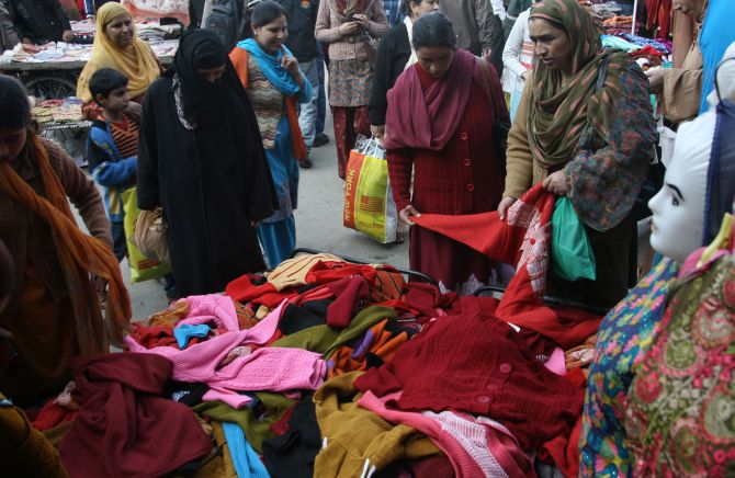 Women buying woollens at a market in Srinagar as winter sets in