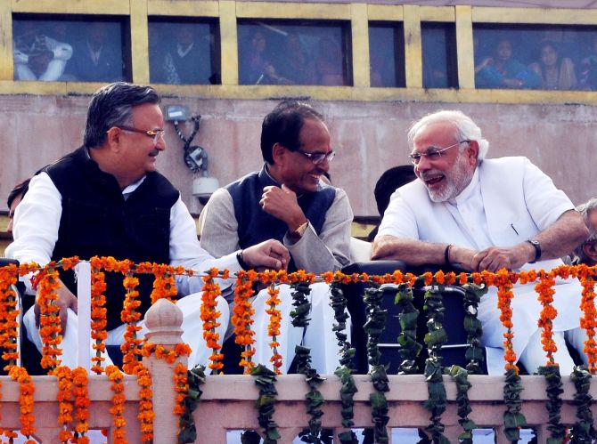 Narendra Modi shares a lighter moment with Shivraj Singh Chouhan and Raman Singh