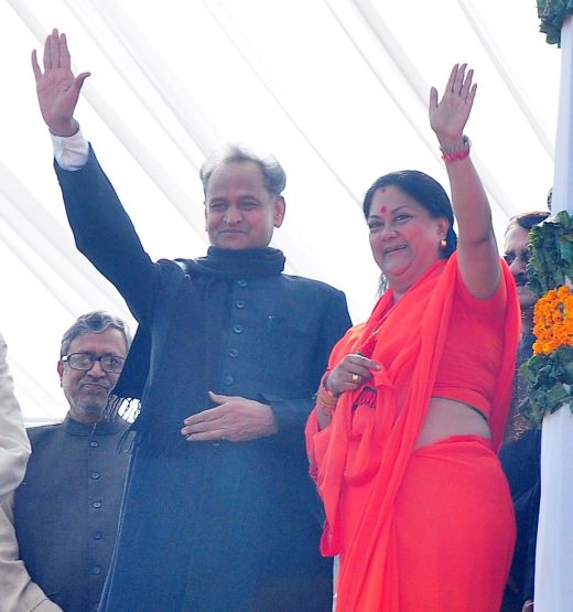 Vasundhara Raje waves to the crowd with former CM Ashok Gehlot
