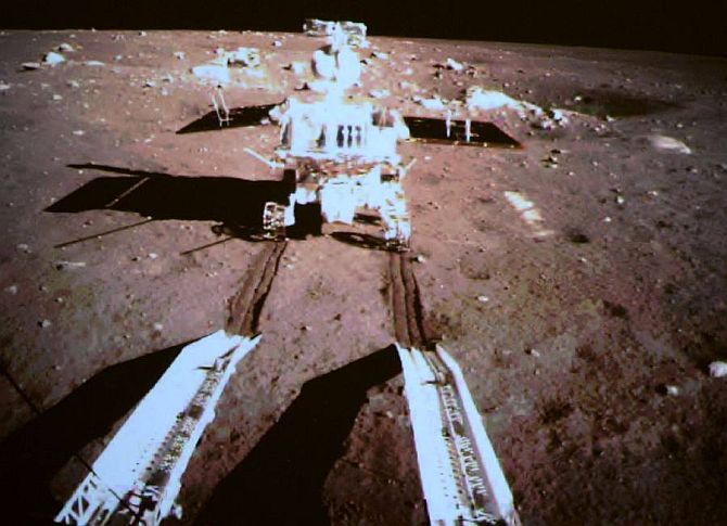 Moon rover Yutu, or Jade Rabbit, drives away from Chang'e 3 lander.