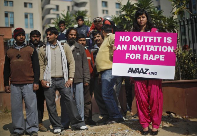 A demonstrator holds a placard during an anti-rape protest in New Delhi