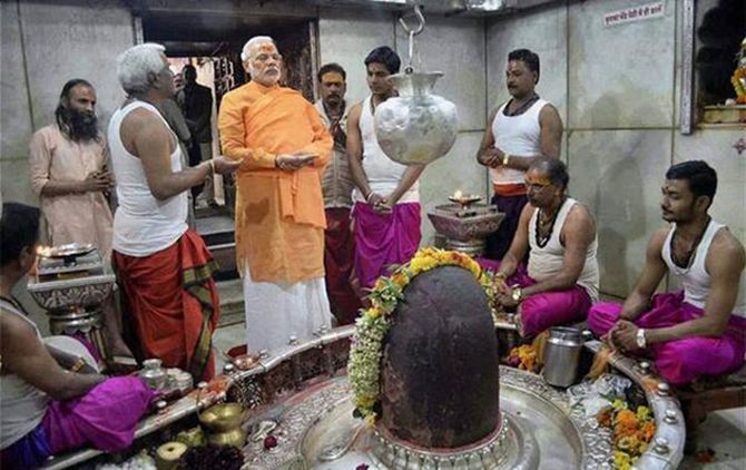 Narendra Modi offers prayers at the Kashi Vishwanath temple in Varanasi, a constituency which he won with an impressive majority.