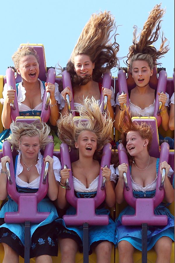 Girls enjoy a fairground ride during Oktoberfest 2013 beer festival at Theresienwiese on September 21, 2013 in Munich, Germany.