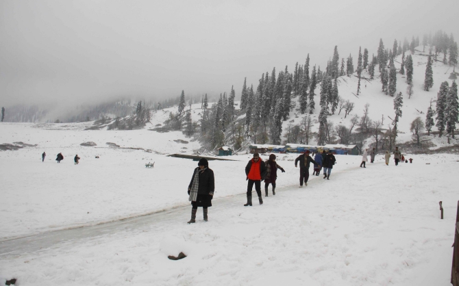 PHOTOS: Srinagar receives season's first snowfall