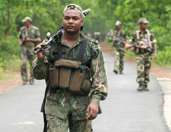 Paramilitary soldiers patrol near a Naxal-dominated village in Chhattisgarh
