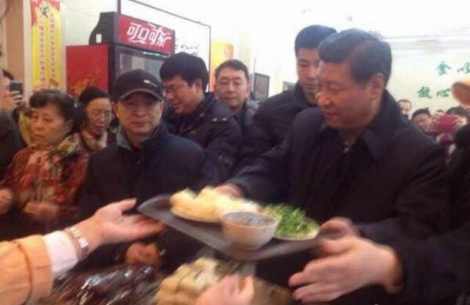 Chinese President Xi Jinping queues up at a bun joint in Beijing