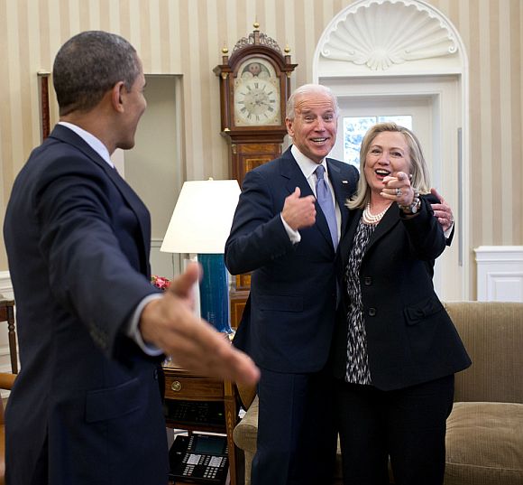 Secretary of State Hillary Clinton had just accidentally dropped all of her briefing papers onto the Oval Office rug and she, the President and Vice President all reacted in a way that indicated that surely this photographer wouldn't get a photo of that to embarrass her