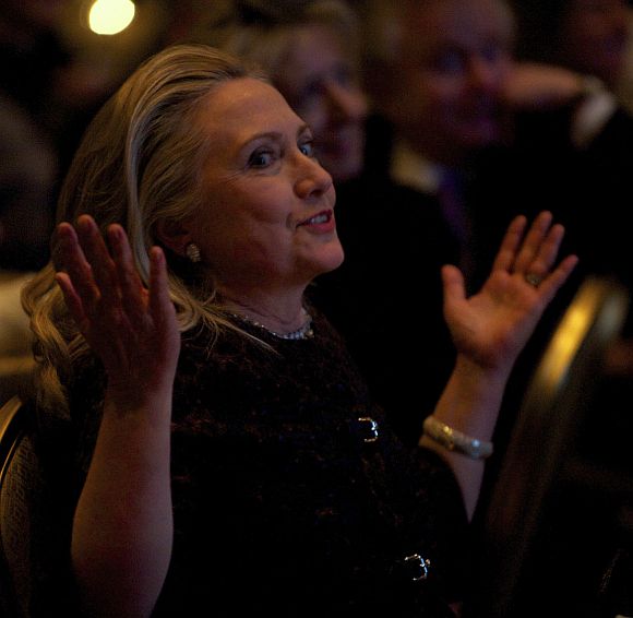Hillary reacts as she watches a video highlighting her career at the 2012 Saban Forum on U.S.-Israel Relations gala dinner at the Willard Intercontinental Hotel in Washington, November 30, 2012