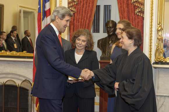 Kerry is congratulated after being officially sworn-in as secretary of state as his wife, Teresa Heinz Kerry looks on