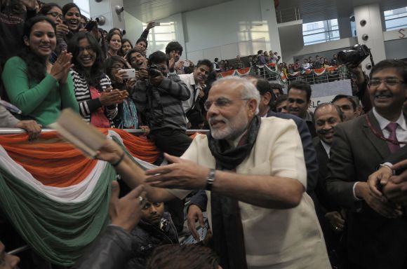 Gujarat Chief Minister Narendra Modi interacts with students and faculty at Delhi University's Sri Ram College of Commerce.
