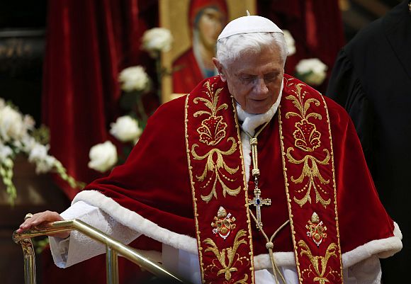 Pope Benedict XVI leaves at the end of a mass at the St Peter's Basilica in the Vatican