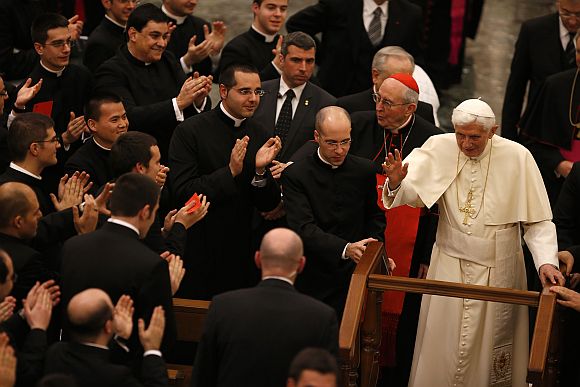 Pope Benedict XVI leaves at the end of a meeting with seminarians at the Romano Maggiore seminary in Rome