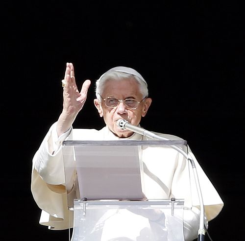 Pope Benedict XVI gestures as he blesses at the end of the Angelus prayer in Saint Peter's square at the Vatican
